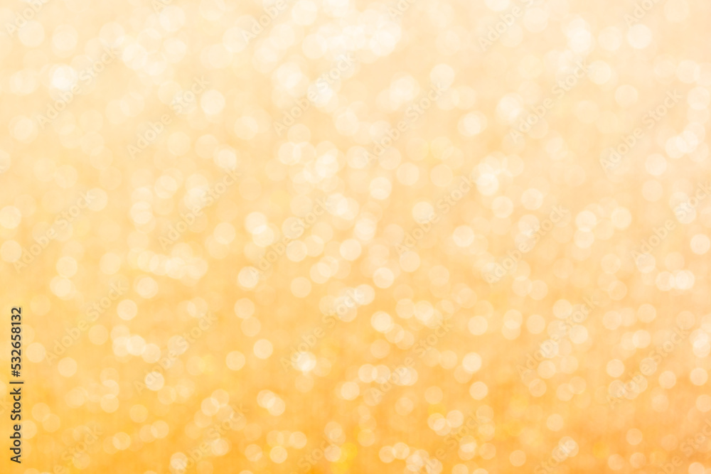 Gold light shiny bokeh abstract blur background with bright round defocus golden pattern