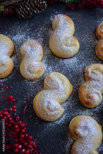 Sweet Swedish buns baked with saffron cranberries and raisins photo