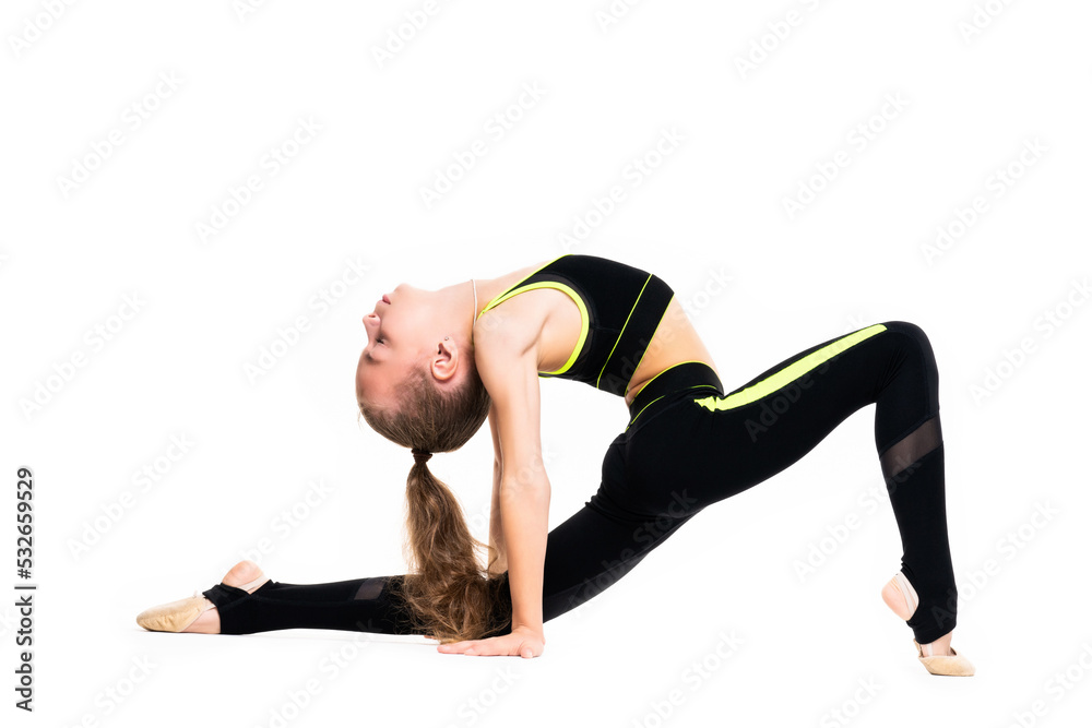 Flexible little girl gymnast in black sports gymnastic suit does acrobatic exercises isolated on a white background with space for text or logo. Sport, workout, fitness, yoga, active lifestyle concept Flexible little girl gymnast in black sports gymnastic suit does acrobatic exercises isolated on a white background with space for text or logo. Sport, workout, fitness, yoga, active lifestyle concept
