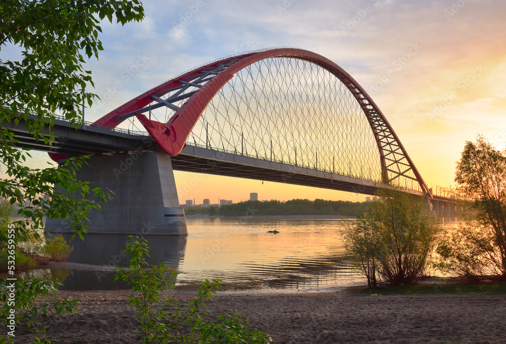 A large arched bridge at dawn