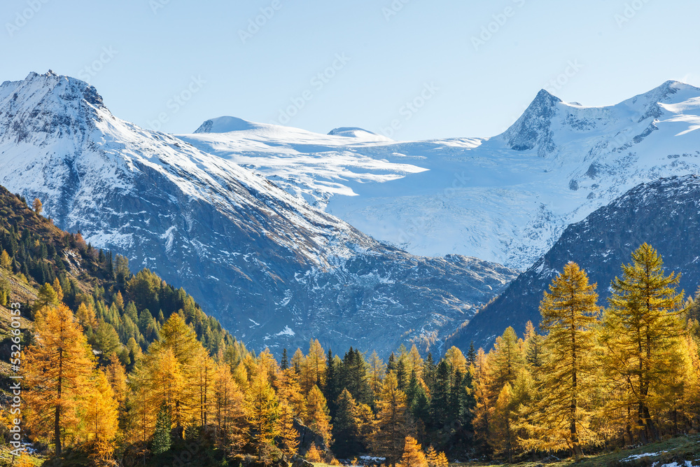 Snow capped mountains and autumn colors