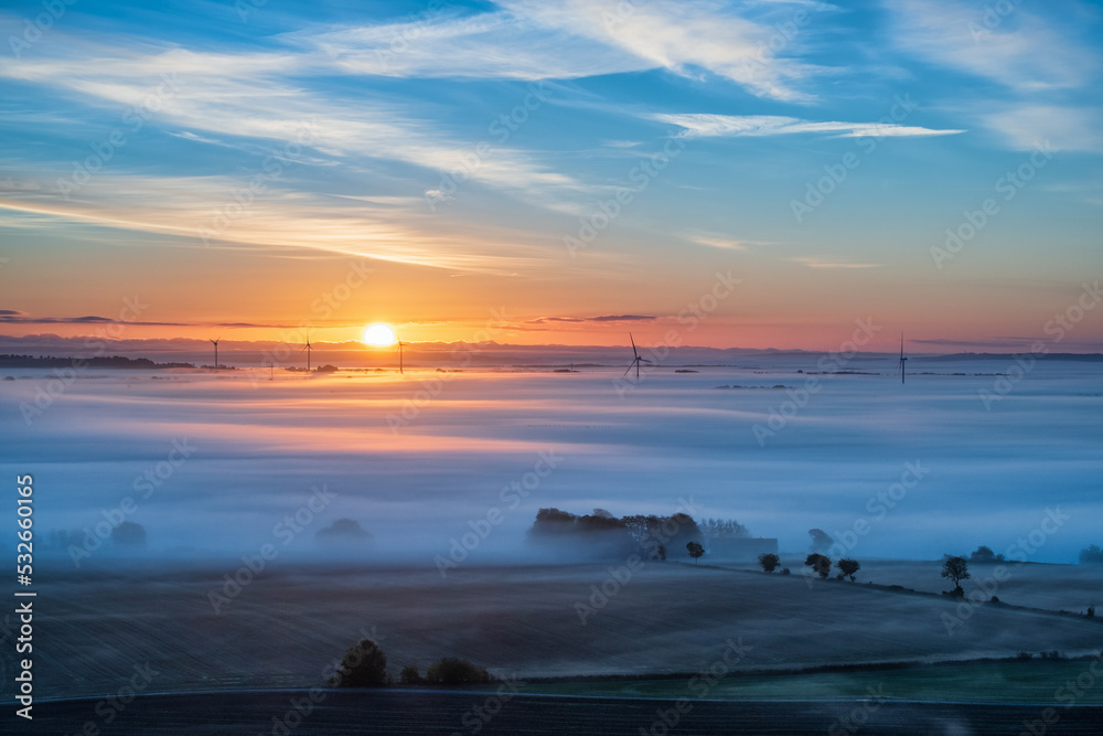 Obraz premium Morning light at a rural landscape with fog