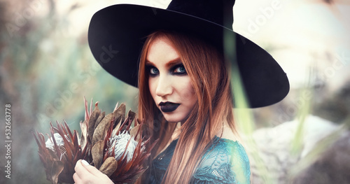 Photographie Portrait of beautiful young witch outdoors