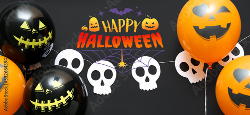 Banner for Halloween with balloons and garland on dark background