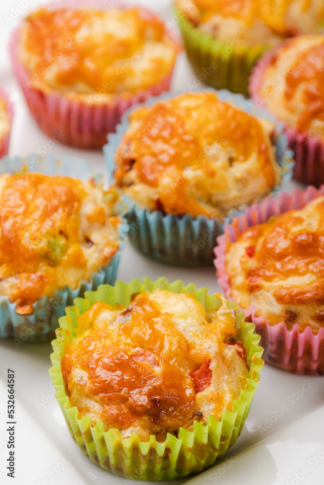 close up of cheesy savory muffins with vegetable close up of cheesy savory muffins with vegetable