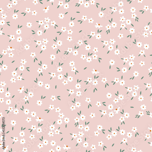 Simple vintage pattern. small white flowers. green leaves. light pink background. Fashionable print for textiles and wallpaper.