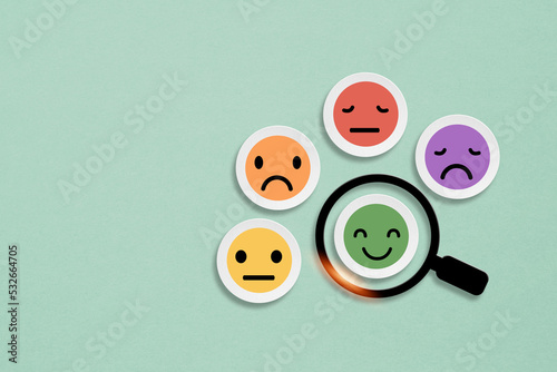 smiling face icon inside on circle grunge white paper cut with magnifying glass  for good feedback rating and positive customer review, experience, satisfaction survey ,mental health concept photo