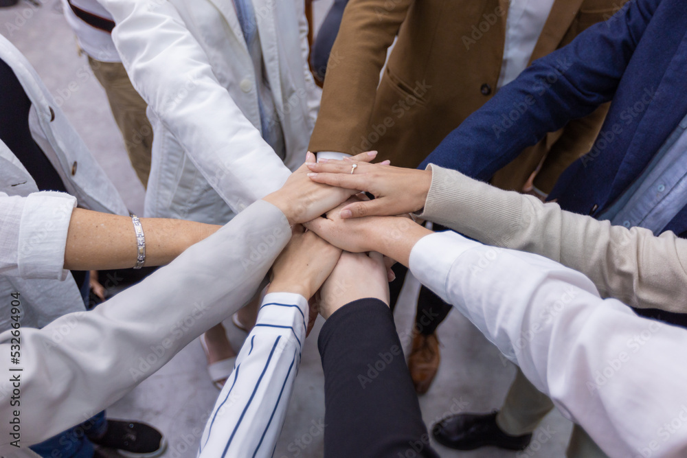 Professional teamwork of business people, woman and man put their hands and holding collaboration together on teamwork Professional teamwork of business people, woman and man put their hands and holding collaboration together on teamwork