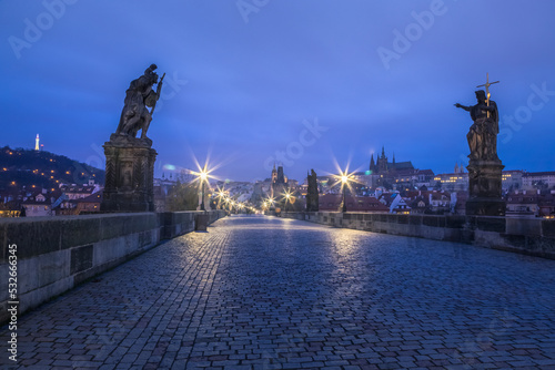 Charles bridge illuminated at dawn  Medieval Prague  Czech Republic