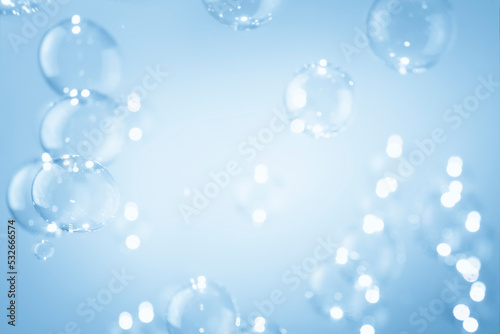 Abstract Beautiful Blurred, Defocus Soap Bubbles Floating on A Blue. Refreshing Soap Sud Bubbles Water.