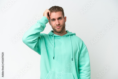 Young handsome caucasian man isolated on white background with an expression of frustration and not understanding © luismolinero