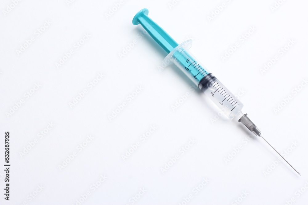 Medical syringe on a white background. A syringe for injection. The concept of health and beauty Medical syringe on a white background. A syringe for injection. The concept of health and beauty