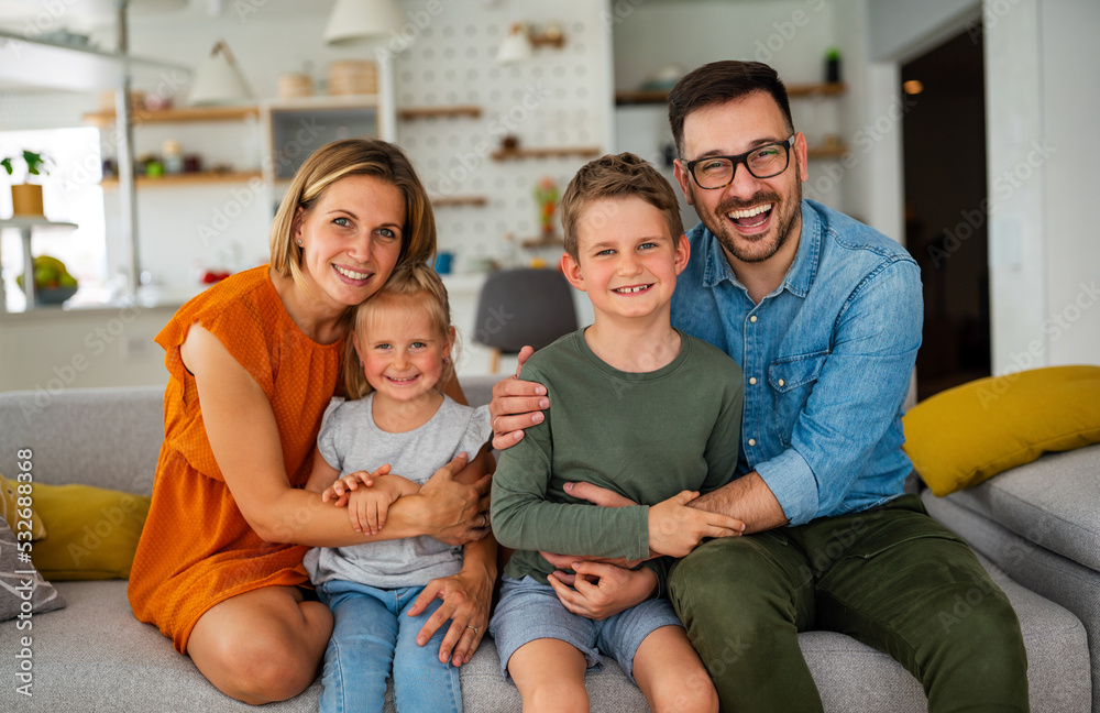 Happy family having fun time at home. Parents playing smiling with childrens together. Happy family having fun time at home. Parents playing smiling with childrens together.