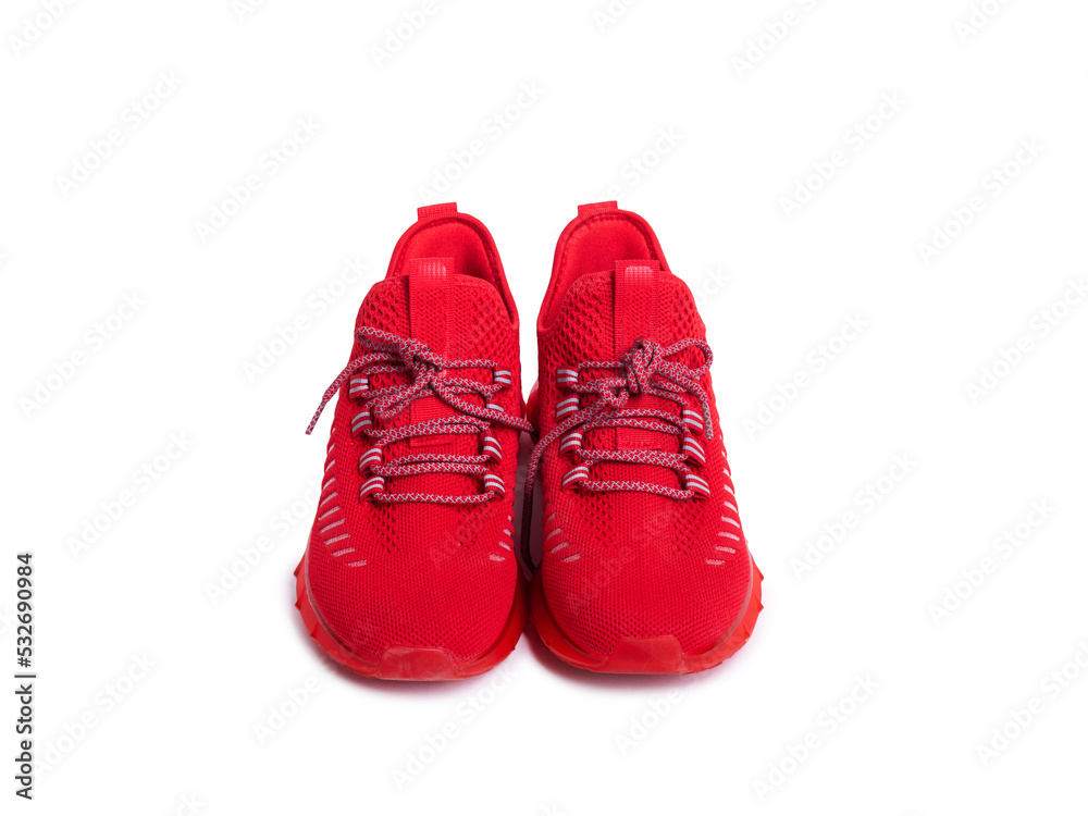 pair of red sneakers on a white isolated background. Sports shoes for running and sports.