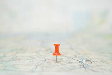 Selective focus of Red pin  on map background