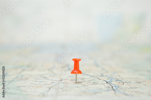 Selective focus of Red pin  on map background