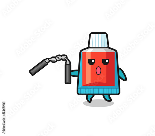cartoon of toothpaste using nunchaku
