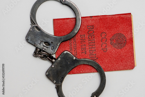 Photo The Russian military ID card has handcuffs on it