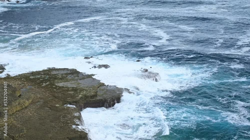 Drone capture the swell of Cantabrian sea hitting the shore of the island of Isla, Cantabria from high altitude Drone capture the swell of Cantabrian sea hitting the shore of the island of Isla, Cantabria from high altitude
