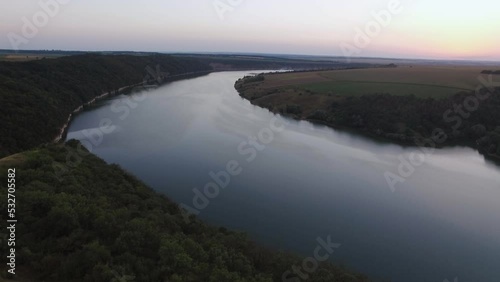 Wallpaper Mural Magnificent aerial of rock cliff with the Ukrainian flag in valley with river Torontodigital.ca