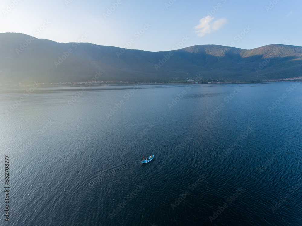 Aerial view of a small fishing boat in a lake, Bafa Lake, Turkey
