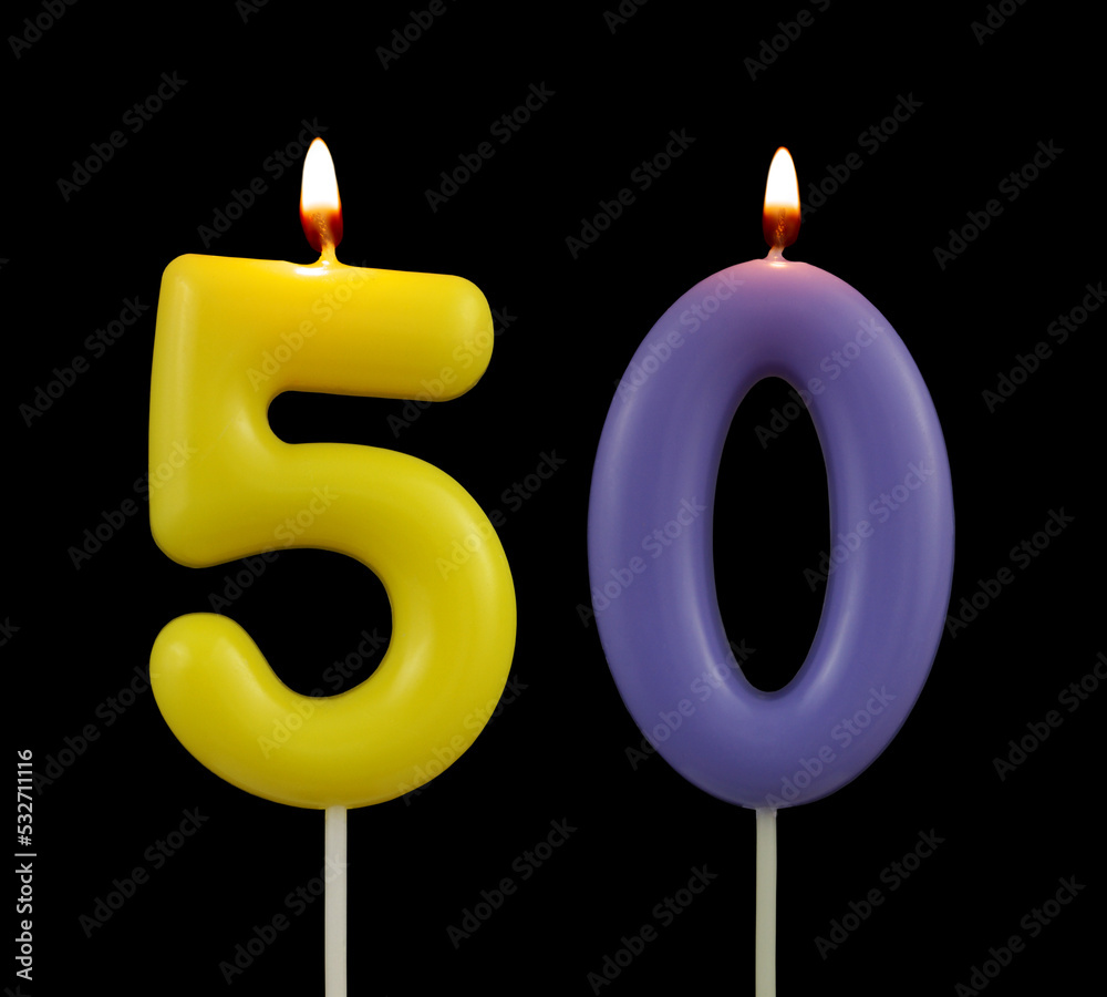 Burning birthday candles isolated on black background, number 50 Burning birthday candles isolated on black background, number 50