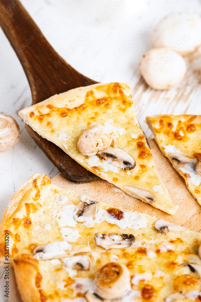 Tasty fresh baked pizza with champignons and chicken fillet