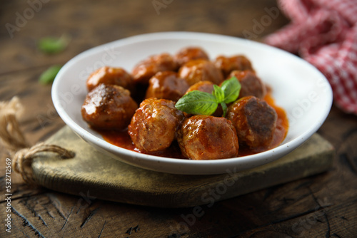 Meatballs with tomato sauce and basil