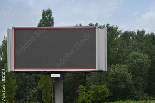 Blank advertising board outdoors. Mockup for design