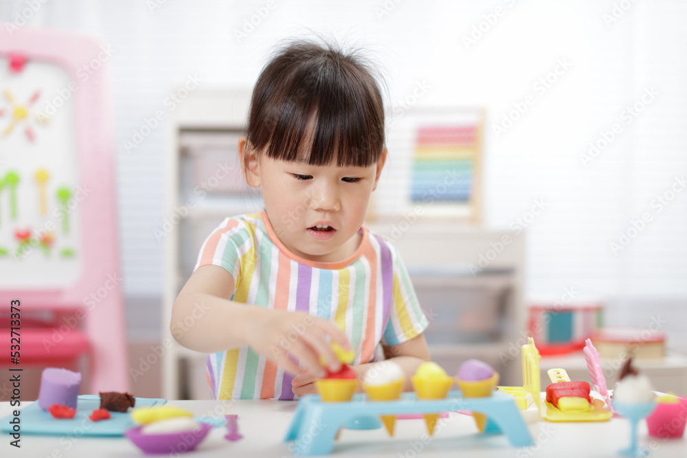 young girl making food using dough tools for homeschooling young girl making food using dough tools for homeschooling