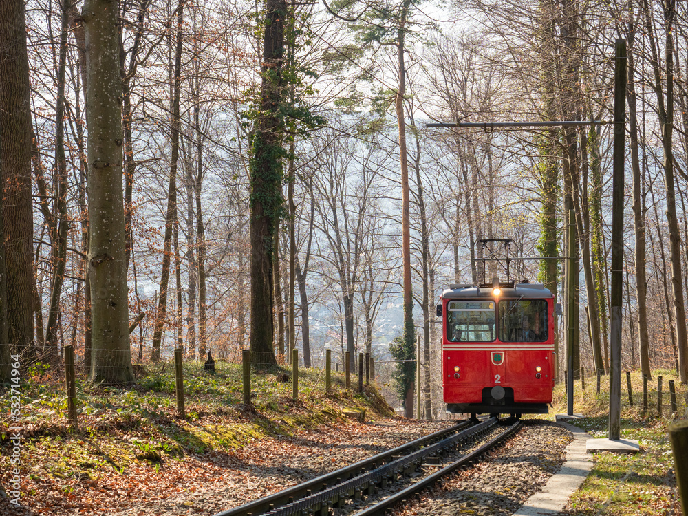 Naklejka premium Zurich, Switzerland - March 26th 2022 - Red waggon of the Dolder cog railway 