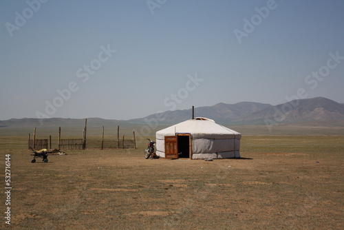 A nomadic tent (ger) in the evening silence of the huge steppe, Tuv province, Mongolia. The Mongol ger or moveable nomadic tent is a uniquely ancient architecture for the nomads of Mongolia.  photo