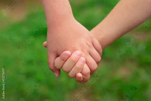 Two children's hands are holding each other © Y.Skybyk