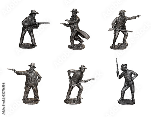 Cowboys. Gunslingers from the Wild West in different poses. Photo with tin figures. photo