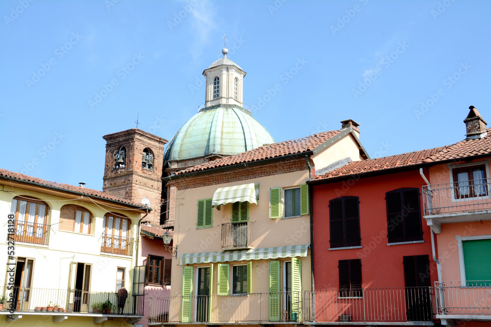 The historic center of medieval origin of Gassino Torinese with the colorful houses of Piazza Sampieri and the Renaissance copper dome of the  Spirito Santo.