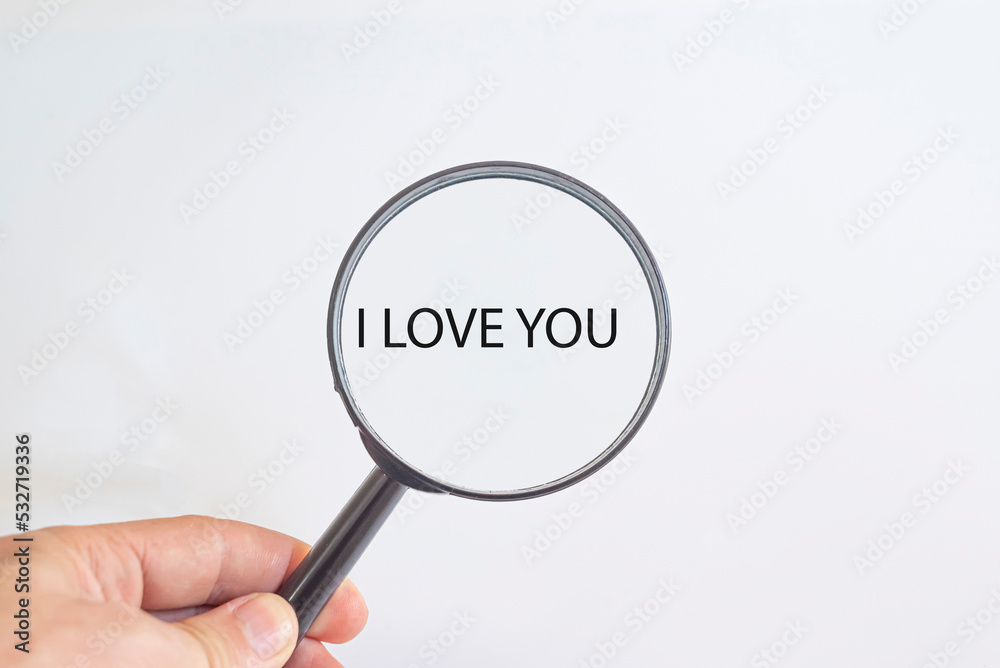 I love you text in magnifying glass. Valentine's day idea concept. I love you text in magnifying glass. Valentine's day idea concept.