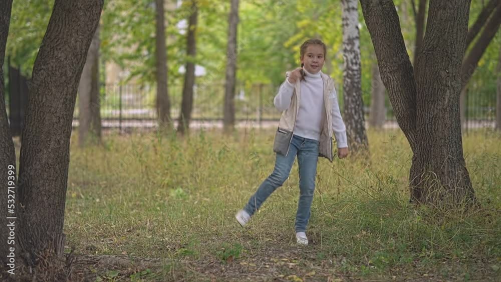 girl dancing in the park in autumn girl dancing in the park in autumn
