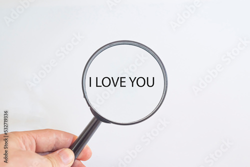 I love you text in magnifying glass. Valentine's day idea concept.