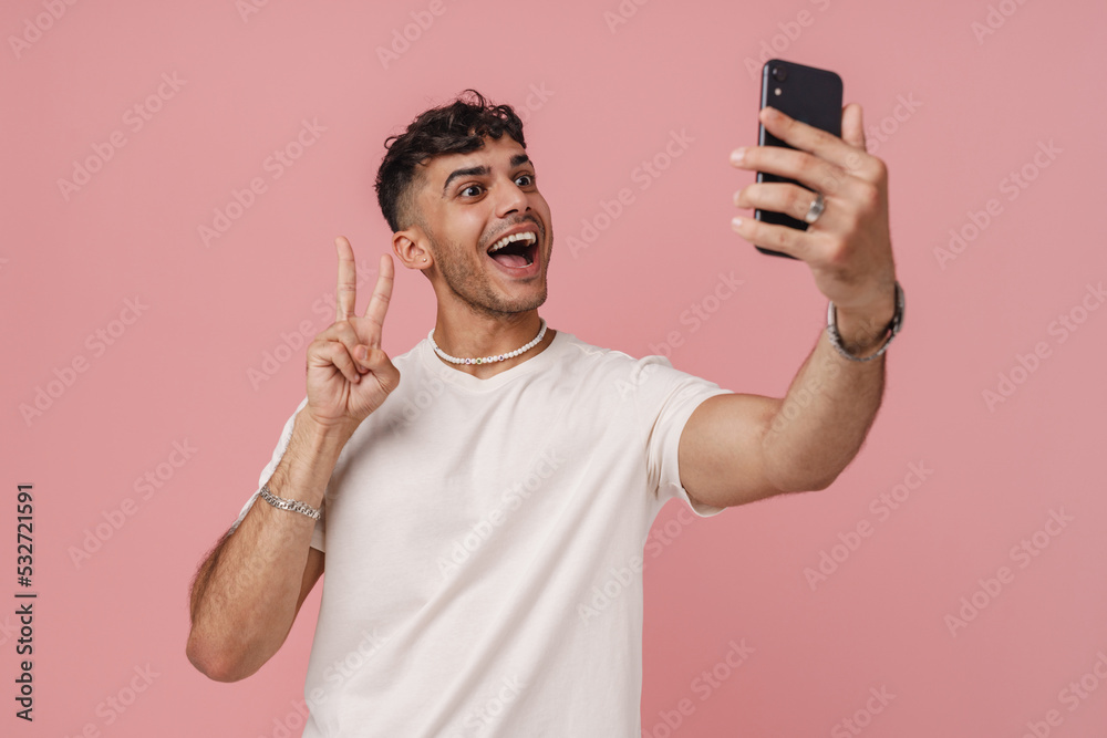 Young stylish man with opened mouth taking selfie with phone Young stylish man with opened mouth taking selfie with phone