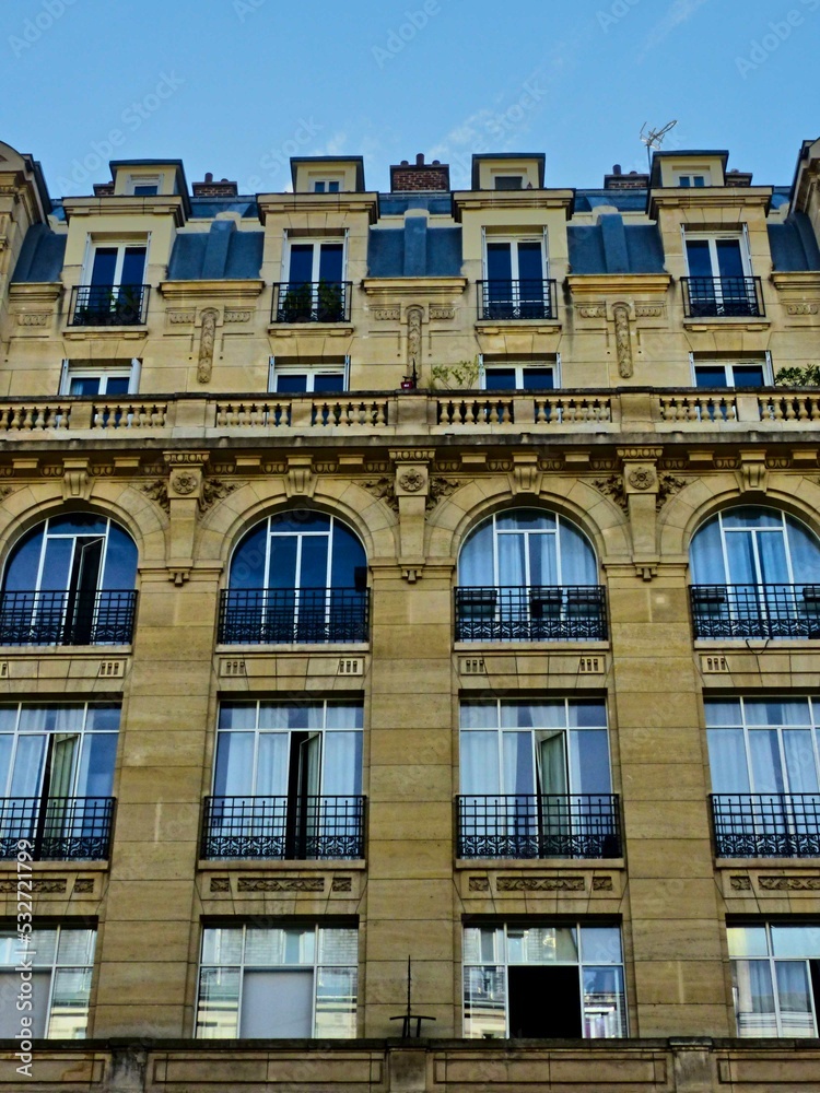Paris, September 2022 : Visit of the magnificent city of Paris, Capital of France - View on different facades of buildings built by Baron Haussmann	