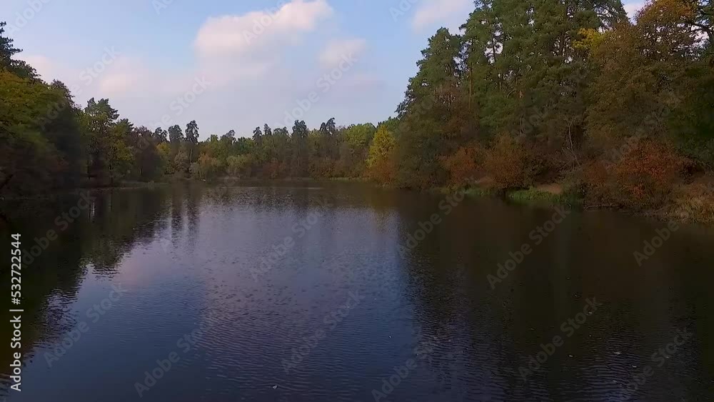 Video shooting by drone of a city park with a forest and a lake Video shooting by drone of a city park with a forest and a lake