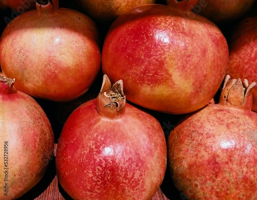 Fresh pomegranate (Punica granatum) fruit red anaar rodie nar melograno anor grenadefruit anar delima granateple granatapfel granatovyyfruit frantafruit shiliufruit dalimafruit closeup view image pho  photo