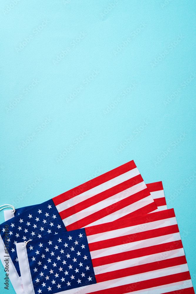 United States election design concept, American Flag over blue table background. United States election design concept, American Flag over blue table background.