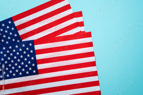 United States election design concept, American Flag over blue table background.