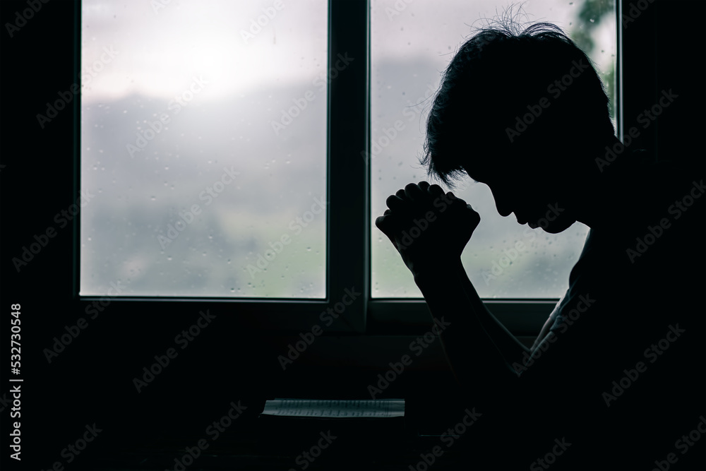 Φωτογραφία Silhouette of person praying in church, concept for faith, spirituality and religion, with copy space , space for text