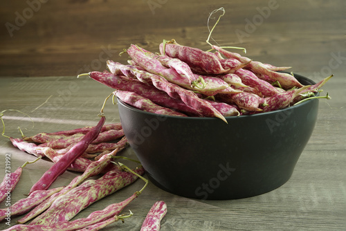 Beans on the table and in the bowl photo