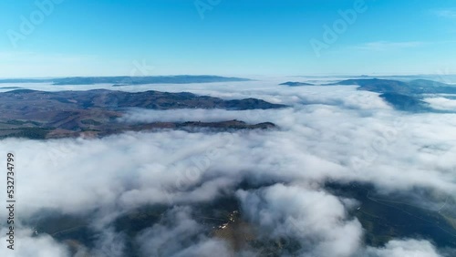 Wallpaper Mural Fly Above Clouds Over Mountains with Blue Sky in the Background. Nature Background. Travel Concept Torontodigital.ca