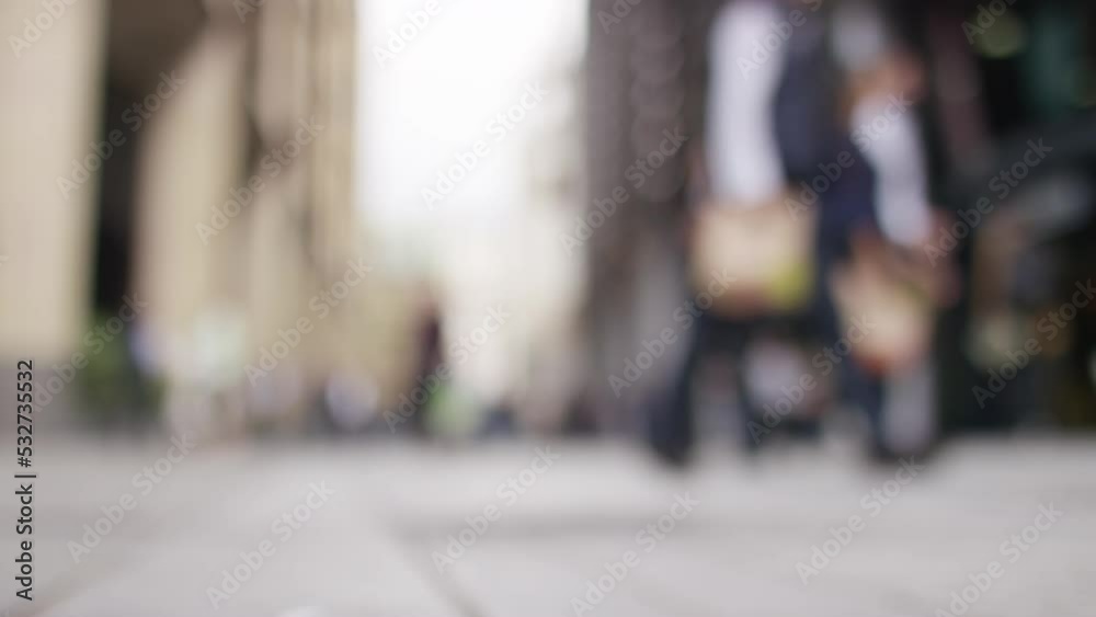 Wide angle blurred background of pedestrians in a city district, in slow motion Wide angle blurred background of pedestrians in a city district, in slow motion