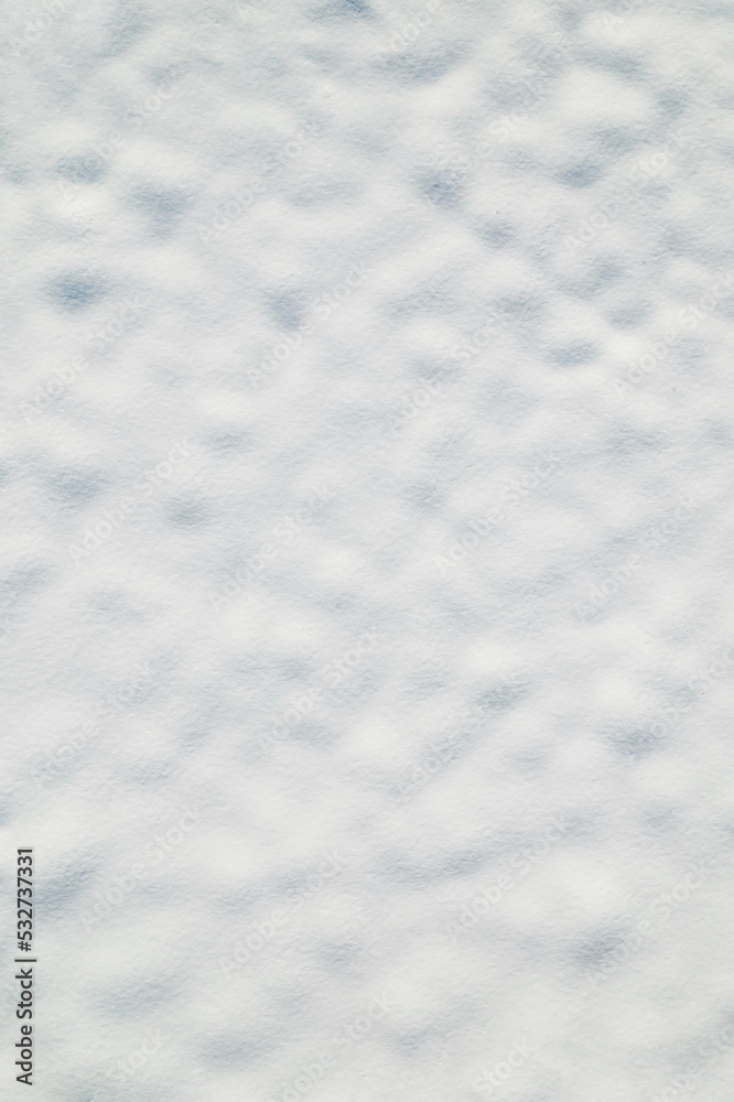 Snow texture. Snow covered land. Winter. Aerial, top view. Drone photo. Background