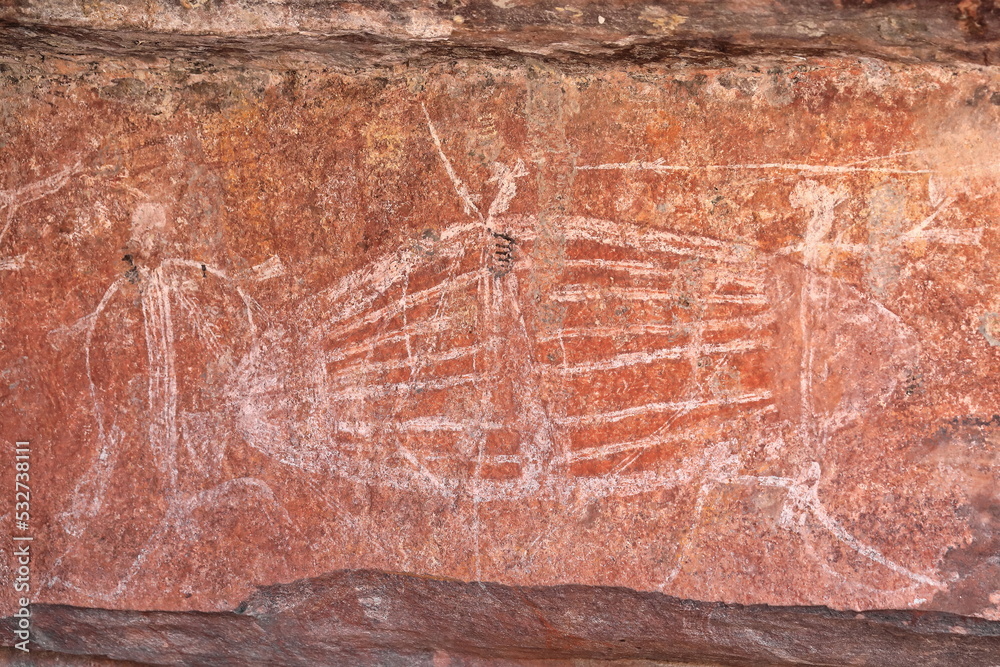 Fototapeta premium Aboriginal rock art: turtle being hunted by locals from a paperbark raft. Ubirr-Kakadu-Australia-193